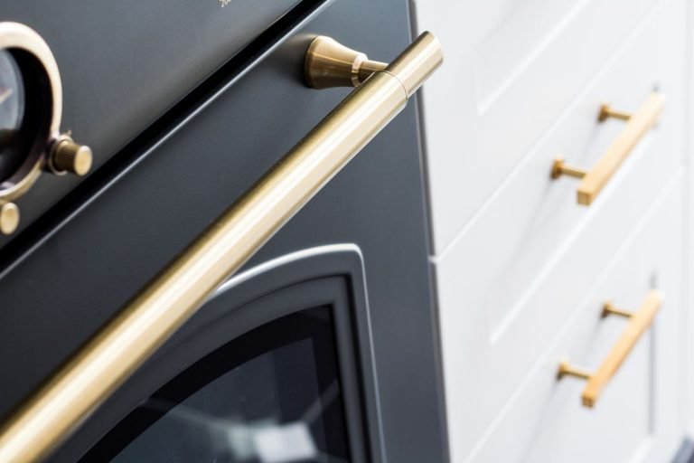 Handles are “kitchen jewellery”, accessorising a simple space. Picture: Getty